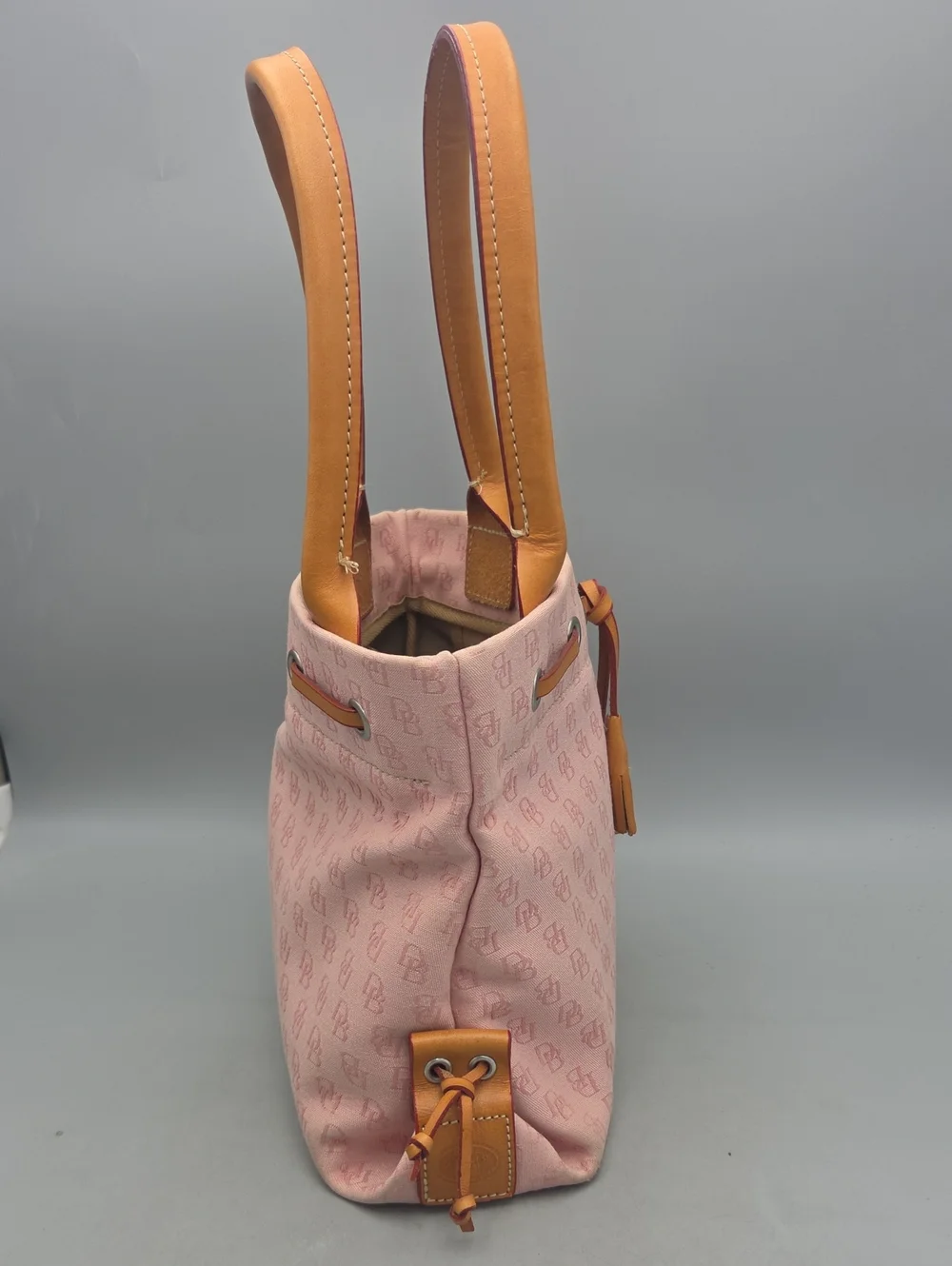 Dooney Bourke DB Monogram Drawstring Tote Canvas Leather Tassel Pink
